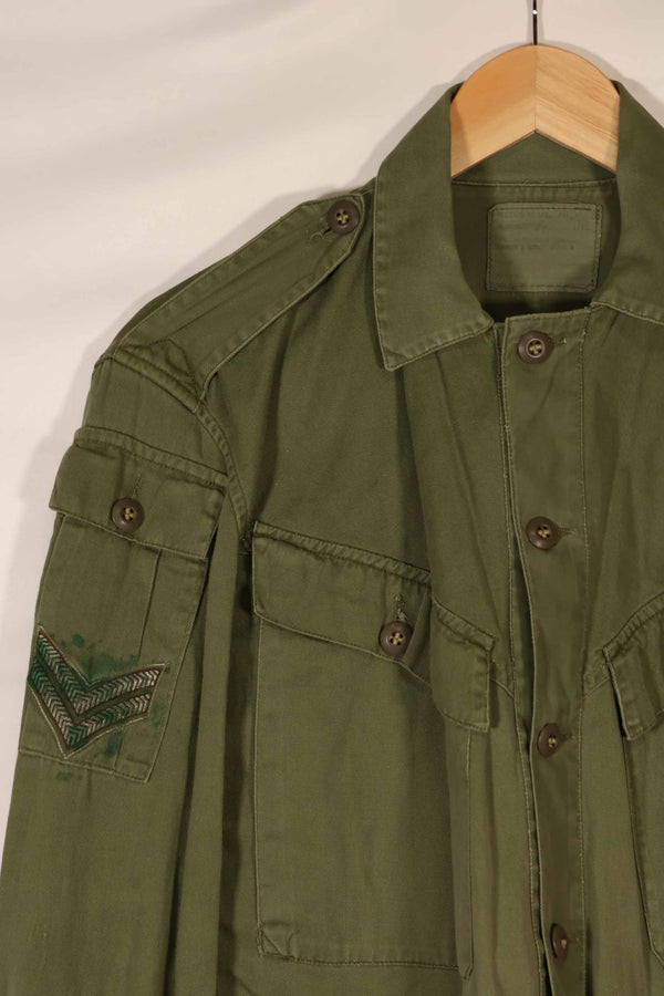 Real 1970 Australian Army OD Fatigue shirt with rank insignia, size unreadable.