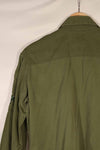 Real 1970 Australian Army OD Fatigue shirt with rank insignia, size unreadable.