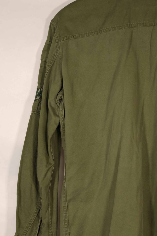 Real 1970 Australian Army OD Fatigue shirt with rank insignia, size unreadable.