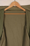 Real 1940s U.S. Marine Corps USMC M41 HBT utility jacket, faded, stained.