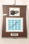 Framed photo and stamp autographed by Air Force Brigadier General Chuck Yeager, commemorating the 50th anniversary of breaking the sound barrier.