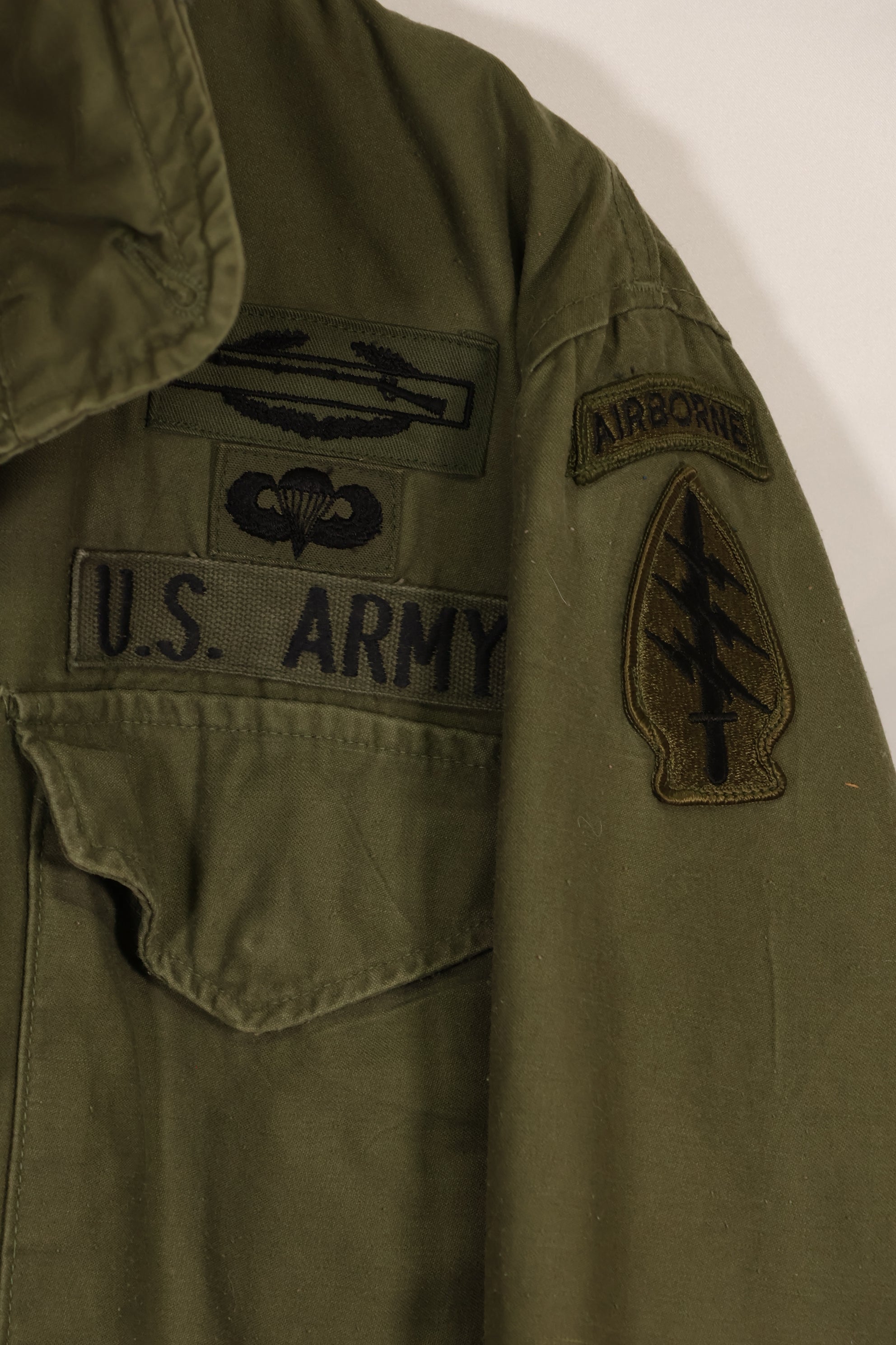 Real owned by former SF member, first model M65 field jacket, estimated 1965-1966, used.