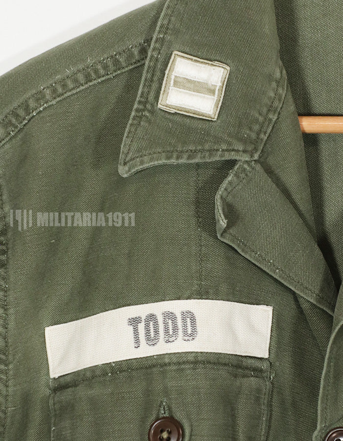 Real early OG-107 utility shirt with special forces patch, faded, used.