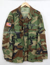 US SURPLUS U.S. Army Special Forces Woodland Camouflage Jacket, 1996, with patches.