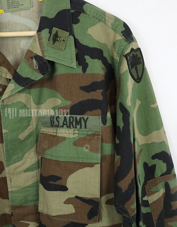 Original U.S. Army Woodland Camouflage Jacket with patches, 1990.